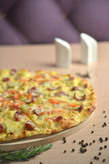 italian pizza on wood table with herbs