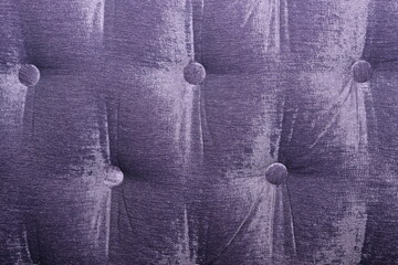 Buttoned velvet wall. Closeup of the texture of a chair