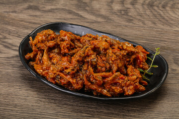 Canned anchovy in tomato sauce
