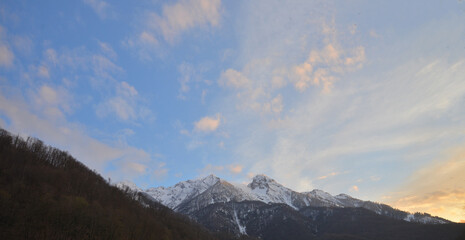 mountains and sky in rosa khutor russia with sunset light