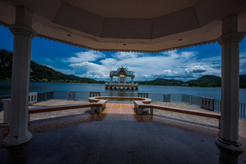 The background of modern design chairs is reflected on the cement floor, placed for viewing the scenery on the building or various attractions.