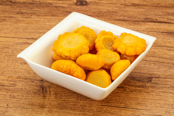 Marinated yellow patisson in the bowl