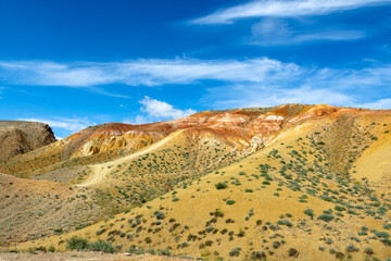 mountain peaks in mountain altai and blue sky with clouds