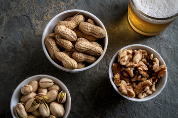 Bowl of nuts and glass of beer