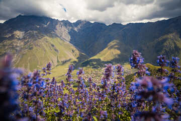 View from Gergeti Trinity Church (Tsminda Sameba) in Kazbegi, Georgia. The Church near the village of Gergeti, under Mount Kazbegi in summer.