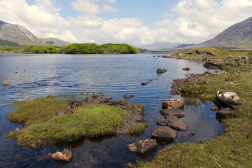 Beautiful landscape scenery of lough inagh with mountains and trees in the background at Connemara National park in county Galway, Ireland 
