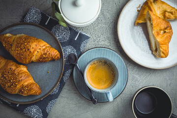 Breakfast - cup of coffee, croissants and curd cheese turnover