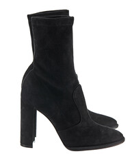 Beautiful pair of classic demi-season high-heeled boots made of black suede, isolated on a white background. Side view.
