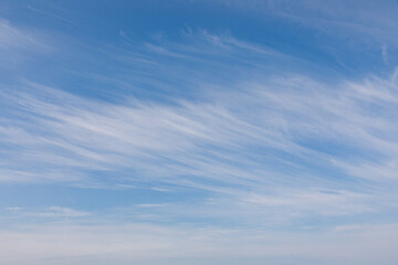 Naklejka na ściany i meble Sky with white clouds over the sea landscape