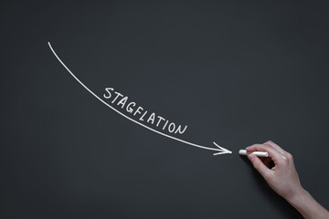 crisis infographics, hand draws a graph of stagflation in chalk on a blackboard, stagnating economy...