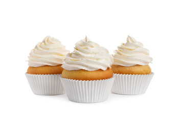 Delicious cupcakes decorated with cream on white background