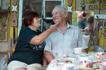 Elderly husband and wife have fun talking to each other.