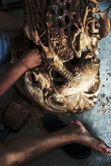wood carving by hands in closeup