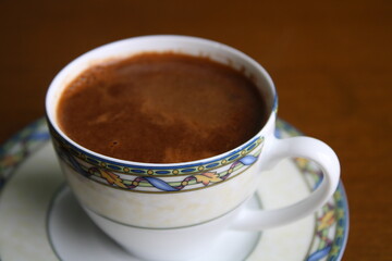 Cup of coffee on table, hot frothy drink, Turkish coffee