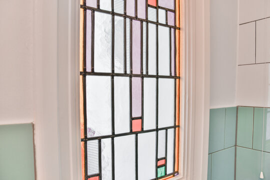 Mosaic Window And Tiled Wall In House