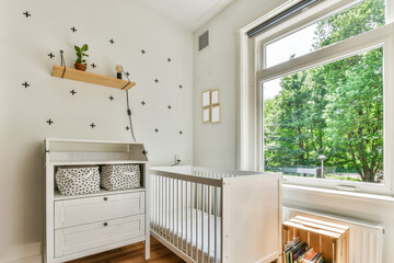 Stylish interior of light nursery