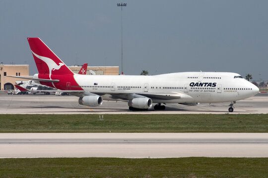 Luqa, Malta April 16, 2005: Qantas Boeing 747-438 taxiing for take off from Malta International Airport. Qantas used to operate direct flights from Malta to Australia in the late 80's and early 90's.