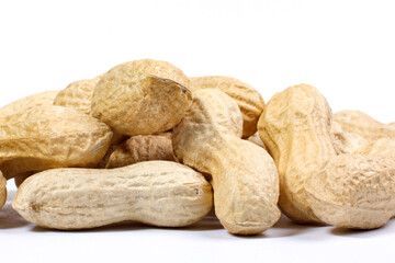 Peanuts in shell and on a white background.