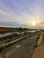 Wetland at sunset, natural delta near the city