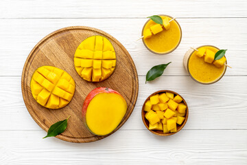 Fresh mango fruits and mango smoothie. Tropical fruits juice