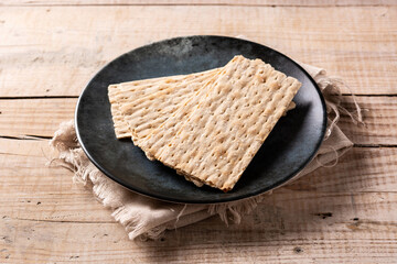 Traditional matzah bread on wooden table
