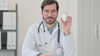 Portrait of Young Doctor Explaining Medication on Video