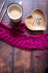 knitting work with needles and pretty pink chunky wool 