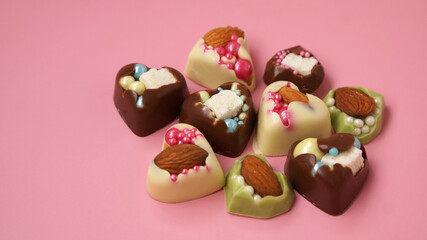 Handmade heart-shaped sweets. Sweets on a pink background. Valentine's Day Candy