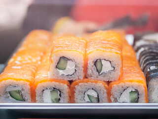rows of rolls in the restaurant window, take away. Traditional asian food