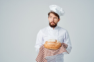 bearded man chef with bread in hand culinary industry