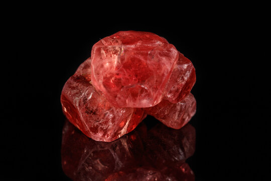 Macro mineral spinel stone on black background