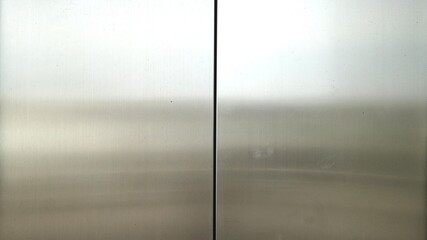 Reflection of light on a shiny metal surface,stainless steel panel background.