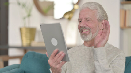 Video Call on Tablet by Senior Old Man