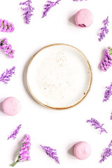 lady morning with macaroons and mauve flowers white background top view mockup