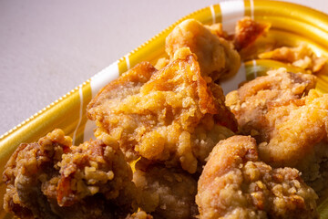Closeup Japanese style deep fried chicken “Tori no Karaage” packed in plastic tray by local supermarket in Japan. In Japan, Karaage is popular food and widely available throughout country