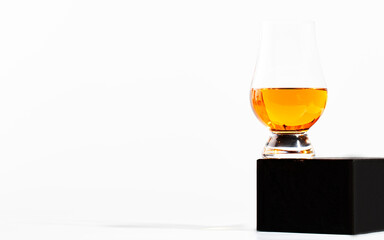 Scotch Whiskey in special glasses and bottle, white background with negative space