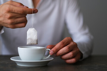 Man preparing herbal tea