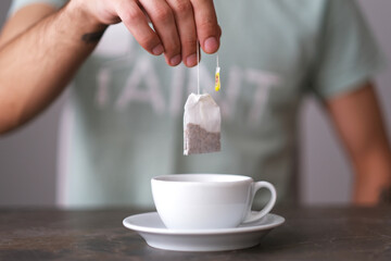 Man preparing herbal tea