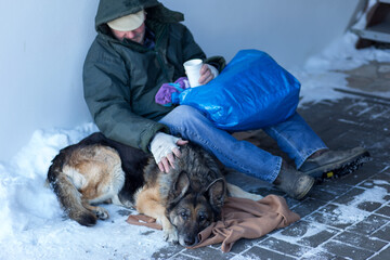 male homeless and his dog
 - obrazy, fototapety, plakaty