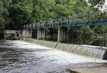 The walkers footbridge over the river Ourthe, on the popular Nisramont Lake circuit walk in the Belgian Ardennes.