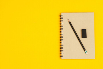 Concept of education top view notebooks and accessories stationery in the library at school yellow...