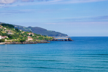 panoramic view of the fishing village of mundaka from the opposite bank of the urdaibai
