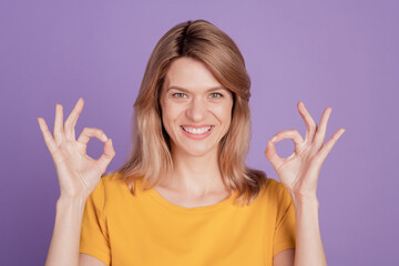 Photo of young cheerful woman happy positive smile show okay perfect cool done cool isolated over violet color background