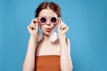 pretty woman in sunglasses bare shoulders fun young close-up