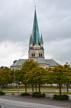 Vertical shot of a Frederikshavn church in Denmark under the gloomy sky