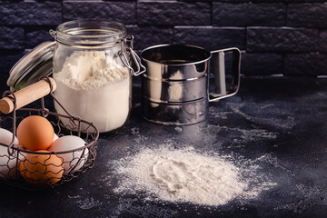 Table with baking products and tools.