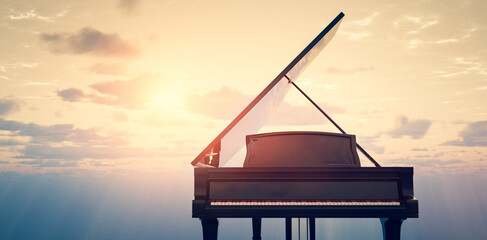 Grand piano on sunset sky background