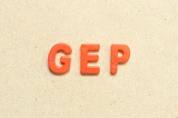 Color alphabet letter with word GEP (abbreviation of good engineering practice) on wood background