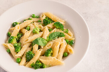 Pasta with green peas, broccoli and parmesan cheese.