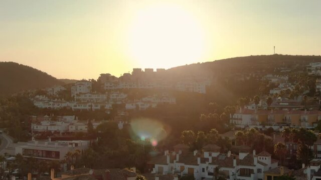 Aerial drone over residential hills at sunset panoramic view